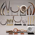 Decorative Ornament Collection With Spiral Circular Horn Shapes And Miniature Figures On Stands