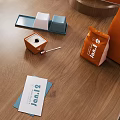 Decorative Ornament Set on Wooden Table with Jamib Brand Boxes Cups and Cards
