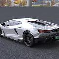 White Lamborghini Sports Car With Sleek Design Sharp Front Black Wheels And Green License Plate