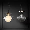 Modern Glass And Brass Spherical Ribbed Pendant Lights Against Dark Wall