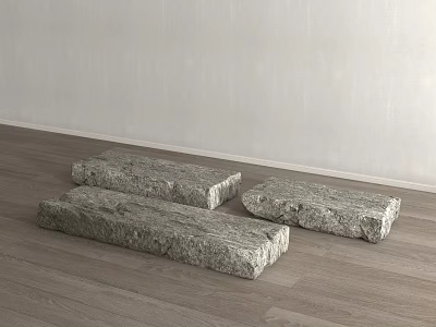 Three Gray Rockery Stones Placed on Wooden Floor With Light Colored Wall Background 3d model