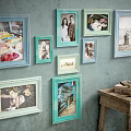 Vintage Colorful Photo Frames on Rustic Wall with Wooden Table and Books