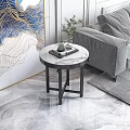 Elegant Side Table With Marble Top And Black Metal Legs Next To Gray Sofa