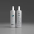 White Cosmetic Spray Bottles With Skincare Product Labels On Gray Background