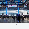 Modern Bar Interior With Blue Lighting Large Background Screens Bar Area And High Stools