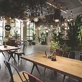 Modern Boutique Interior With Lush Green Plants Hanging Lights And Wooden Tables Chairs