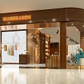 Elegant Modern Clothing Store With Glass Storefront Mannequins Displayed Clothes And Interior Lighting
