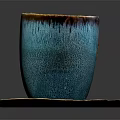 Turquoise Ceramic Cup With Brown Rim And Matching Textured Saucer On Black Surface