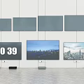 Multiple Wall Mounted And Standing Televisions Displaying Time And Cityscape Views 3d model