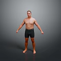 Shirtless Man Wearing Black Shorts Standing Barefoot Against Gray Background