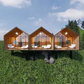 Three Adjacent Rustic Wooden Cabins on Green Grassland With Large Windows and White Sofas