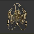 Golden Bat Wing Candelabra With Ornate Design And Two Candles