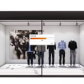 Fashion Store Window Display With Mannequins In Colored Tops And Black White Artwork
