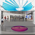 Shopping Mall Lobby With Blue Fan Shaped Ceiling Decoration Purple Circular Logo And People Walking