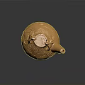 Golden Teapot Shaped Sculpture with Intricate Patterns and Decorative Handles on Stable Base