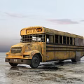 Old Yellow School Bus With Rusted Body On Icy Ground Under Cloudy Sky