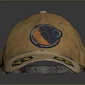 Brown Distressed Baseball Cap With Yellow Leaf Patch And Circular Orange Black Badge 3d model