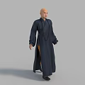 Bald Man in Full Length Dark Blue Robe Standing Against Gray Background