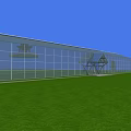 Industrial Factory Building With Large Glass Walls Front Entrance Green Lawn And Blue Sky Background