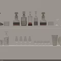 White Shelves With Various Glass Bottles Wine Glasses And Decorative Glassware In Different Sizes Shapes