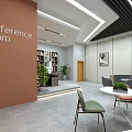 Modern Lounge Area With Circular Bookshelf Comfortable Seating Green Plants And Large Windows
