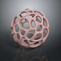 Artistic Pink Hollow Sphere With Intricate Geometric Design And Textured Surface