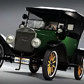 Vintage Green Ford Car With Black Top And Orange Spoked Wheels