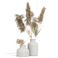 Minimalist Gray Ceramic Vases With Dried Pampas Grass And Flowers On White Background