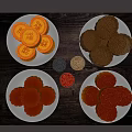 Traditional Assorted Mooncakes on White Plates With Various Fillings and Wooden Tray