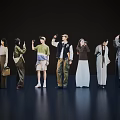 Fashion Models Group Showcasing Various Stylish Outfits on Dark Stage