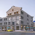 Traditional Commercial Street With Gray Brick Building Multiple Floors Ground Floor Shops And Outdoor Seating