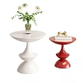 White and Red Round Accent Tables Featuring Vase Plant Gold Decor and Book