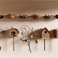 Flying Birds Around Hanging Nests And Birdhouses On Wall With Branches