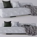 Modern Gray Sectional Sofa with Dark Green and Light Gray Cushions and Striped Throw Blanket