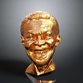 Detailed Golden Human Head Sculpture With Shiny Metallic Surface And Smiling Expression