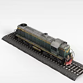 Vintage Green and Yellow Miniature Model Train on Detailed Railroad Tracks