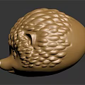 Golden Hedgehog Head Sculpture With Textured Spines And Reflective Surface