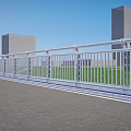 Modern White Railing Along Paved Road With Green Grass Tall Buildings And Blue Sky