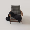 Comfortable Leisure Chair With Gray Cushioned Backrest Walnut Wooden Armrests And Black Knitted Blanket