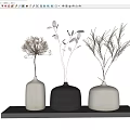 Minimalist Decorative Ornament Set With White And Black Vases Holding Dried Flowers And Branches