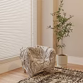 Plush Textured Single Seater Sofa With White Potted Plant White Blinds And Wooden Floor Rug