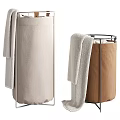 Two Different Colored Fabric Laundry Baskets With Towels And Metal Frames