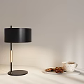 Modern Black Table Lamp With Golden Accent Coffee Cup And Cookies On Table
