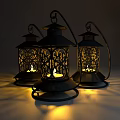 Three Black Metal Vintage Style Outdoor Lights With Intricate Cutout Patterns Lit Inside