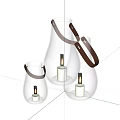 Transparent Glass Lanterns With Leather Handles And Lit Candles For Home Decor