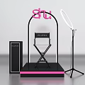 Pink Shu Themed Photo Check-in Spot Featuring Ring Light Director Chair And Black Platform