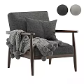 Cozy Gray Armchair With Wooden Frame Pillows And Pom Pom Blanket