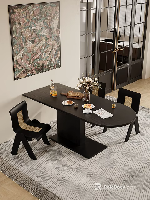 Black Oval Dining Table Set With Woven Chairs Flower Vase Food Items And Wall Art 3d model 