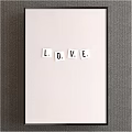 White LOVE Letters Arranged On Light Background With Dark Frame