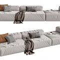 Modern Light Gray Sectional Sofa With Brown Checkered Pillows Knitted Throw Blanket And Magazines